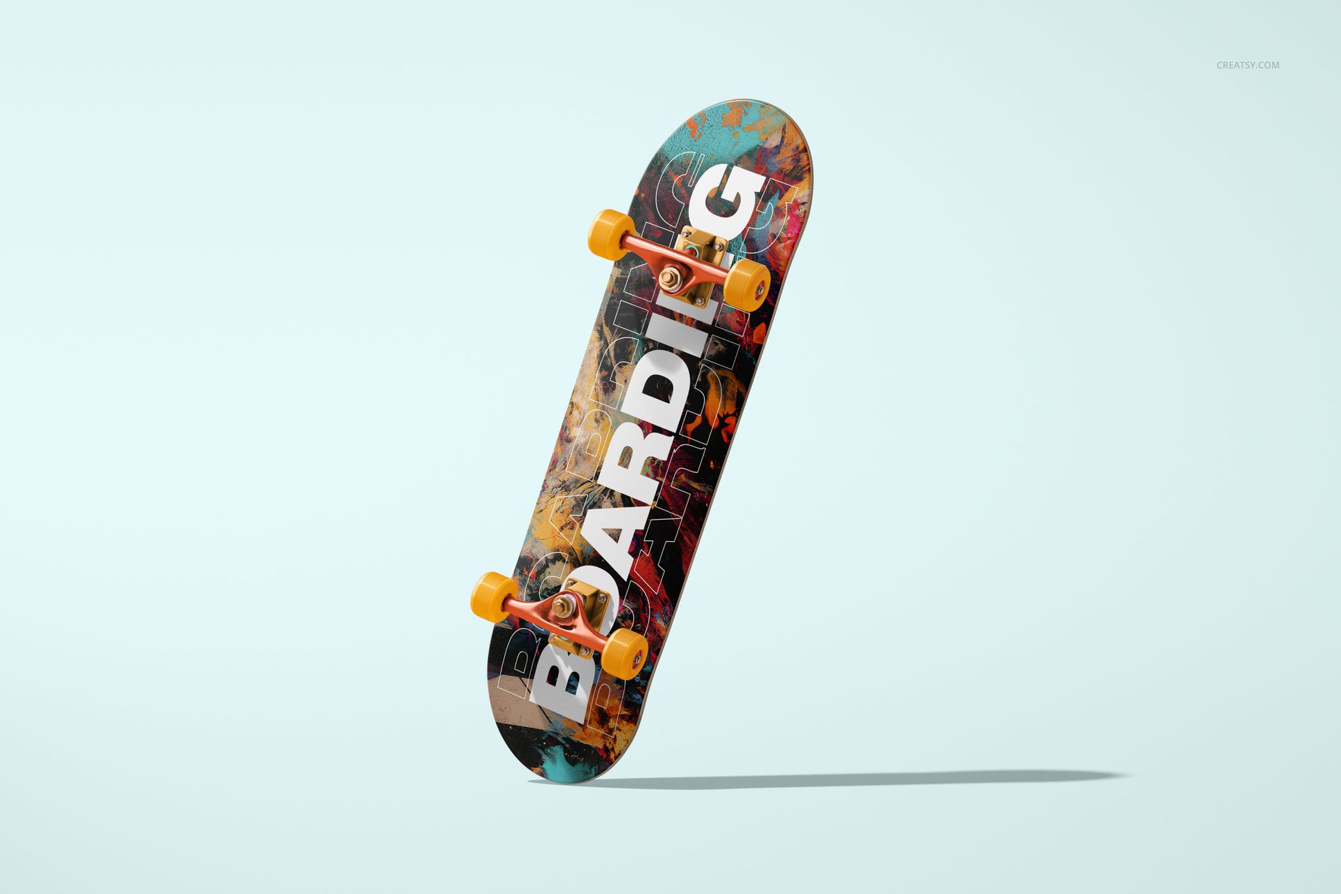 PSD mockup of a skateboard featuring a vibrant design, orange wheels, and shadow on a light background.