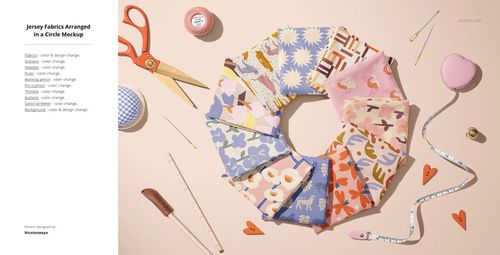 PSD mockup showing multiple jersey fabric swatches in a ring formation, accented by sewing accessories and pink background.