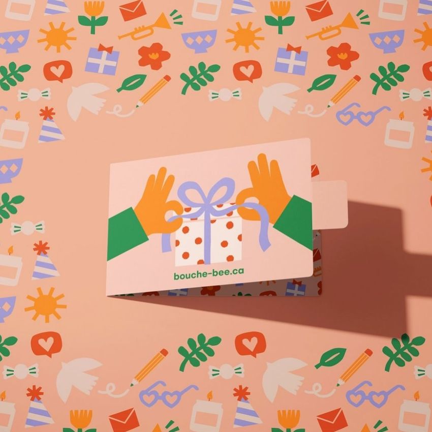 Gift card holder mockup featuring an illustrated card with hands holding a ribbon on a pink patterned background with playful icons.