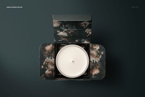 Glass candle mockup set shown from above, featuring a white wax candle in a floral-patterned open box.
