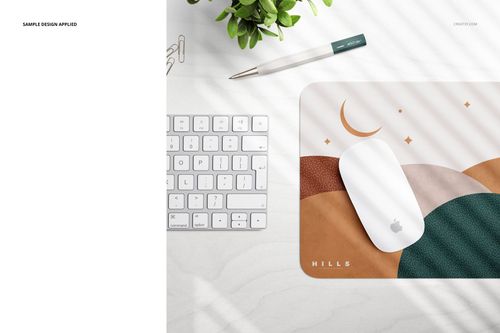 PSD mockup of a rectangular mouse pad with curved shapes in brown and beige, styled with office accessories and soft shadows.