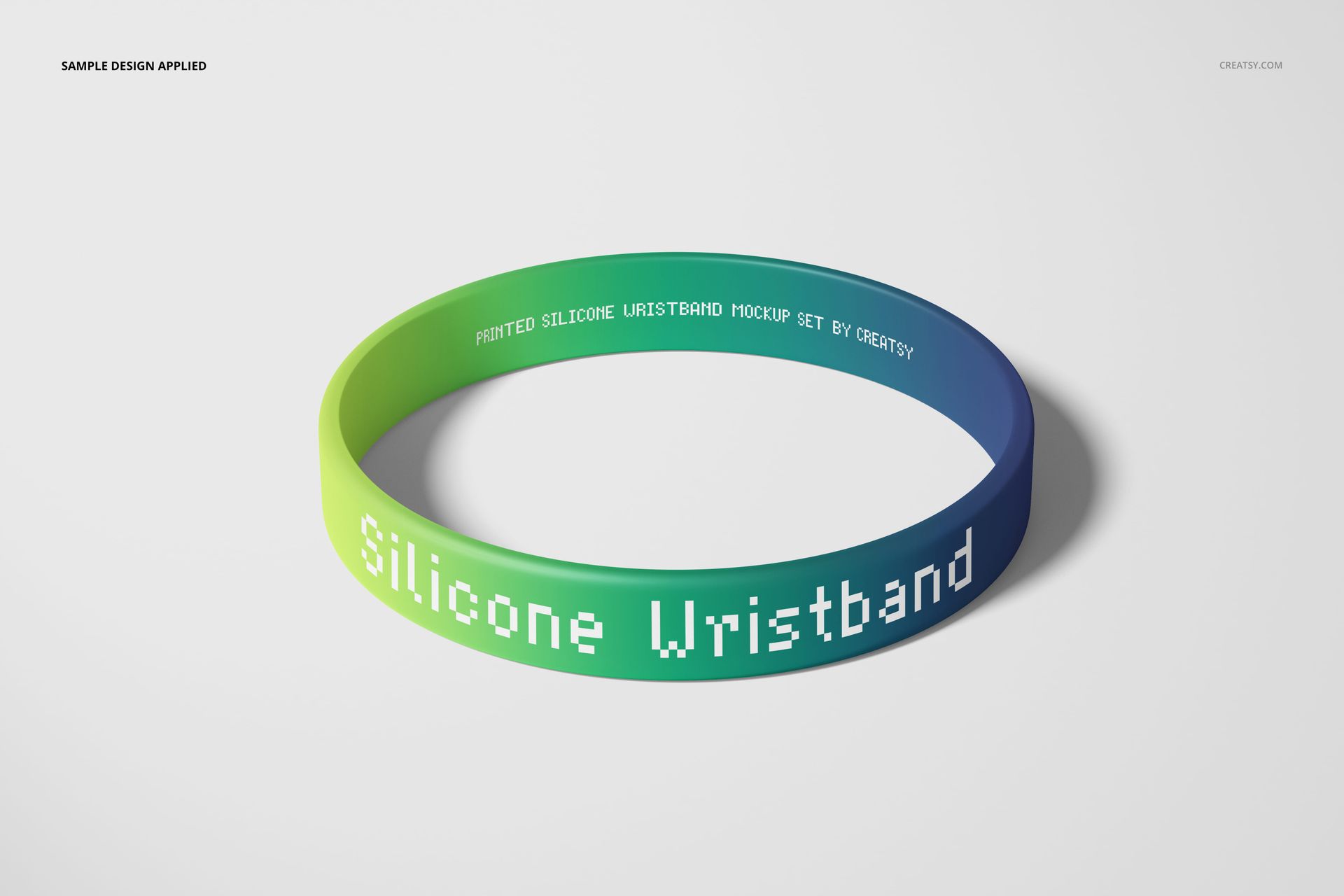Front view of a silicone wristband mockup with green and blue gradient colors and bold white printed text.