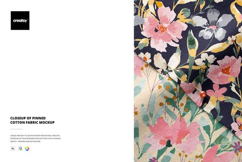Close-up view of cotton fabric with colorful floral pattern, pinned at the corner, shown in a fabric PSD mockup.