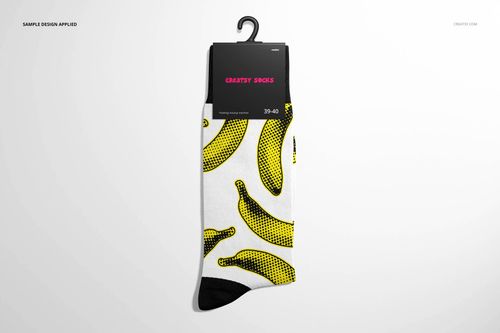 High cuff sock mockup with a white base, black toe, and yellow banana pattern, shown from the front on a hanger.