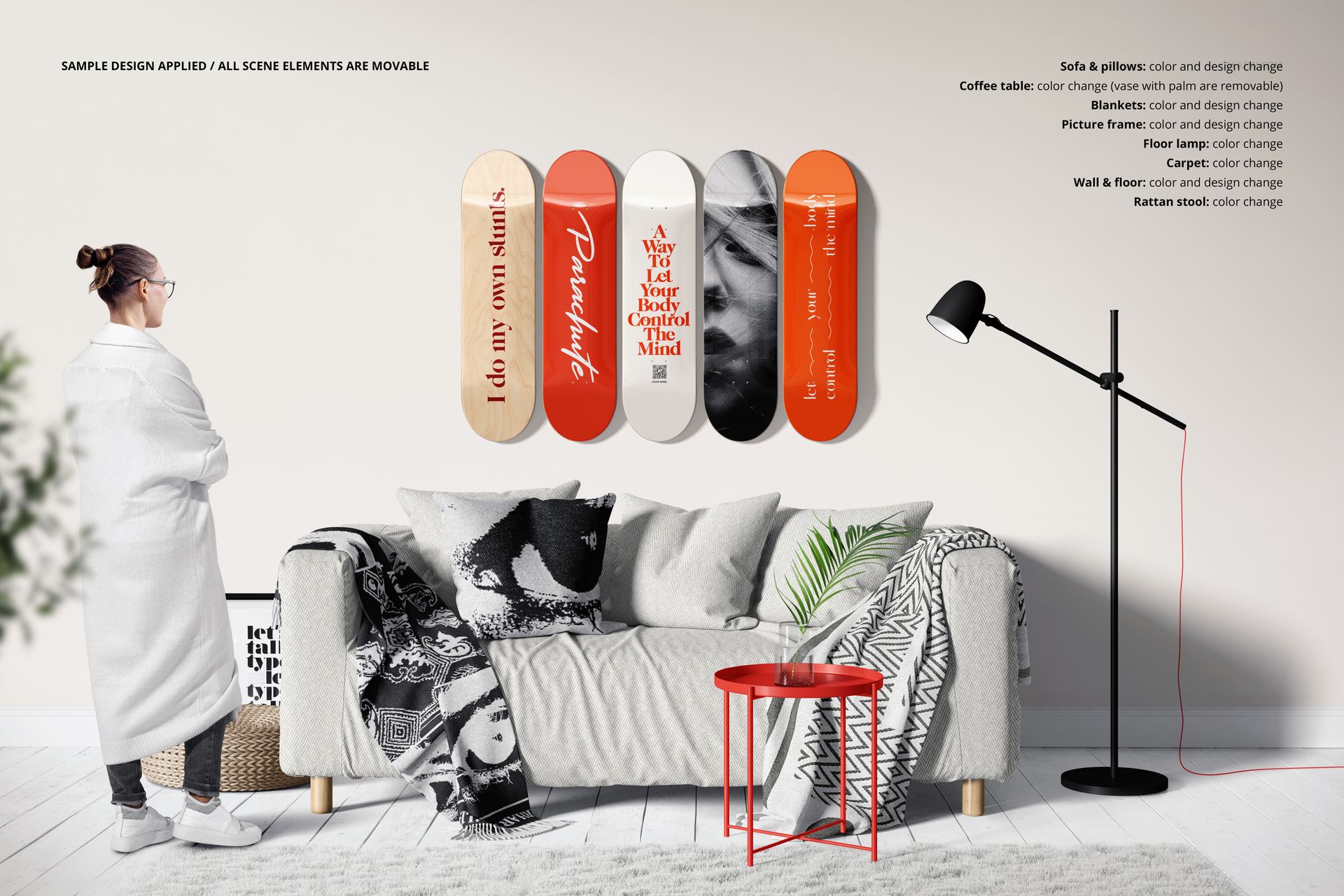 Skateboard decks wall décor mockup set displayed above a couch, with a red side table and monochrome blankets visible.