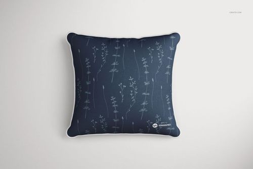 Mockup of a square cushion with white piping, decorated with thin floral stems on a navy blue fabric, top view.