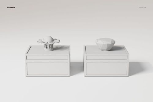 Front view of two art deco jewelry boxes in white, each with a geometric decorative lid, on a plain background.