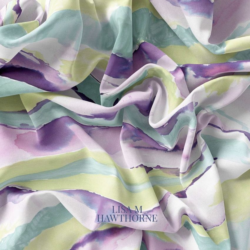 Silk fabric mockup featuring a closeup of draped material with watercolor-style stripes in purple, green, and white tones.