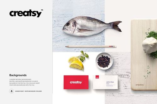 Seafood restaurant mockup with a whole fish, cutting board, mozzarella, lemon wedges, blueberries, and business cards on a white background.