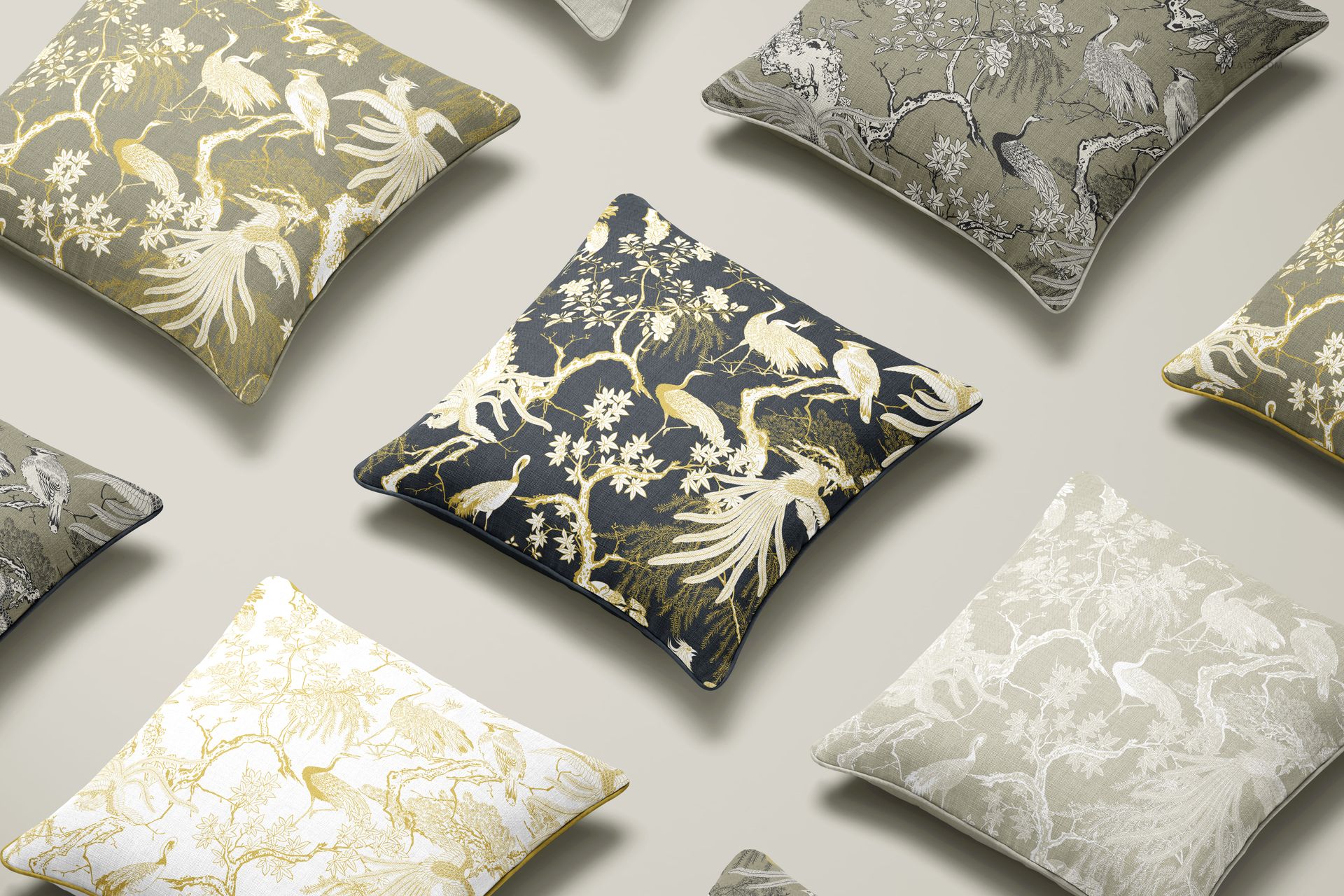 PSD mockup of decorative cushions with piped edges, displaying nature-inspired prints in different color schemes.