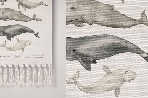 Close-up of a PSD mockup wall banner with gray whale illustrations, textured surface, and decorative fringes at the bottom.
