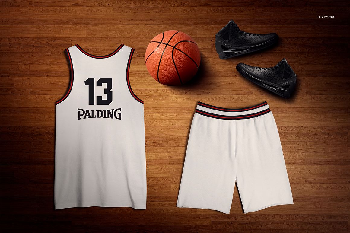 Basketball training uniform mockup set with white tank top and shorts, black shoes, and orange basketball on wood floor.