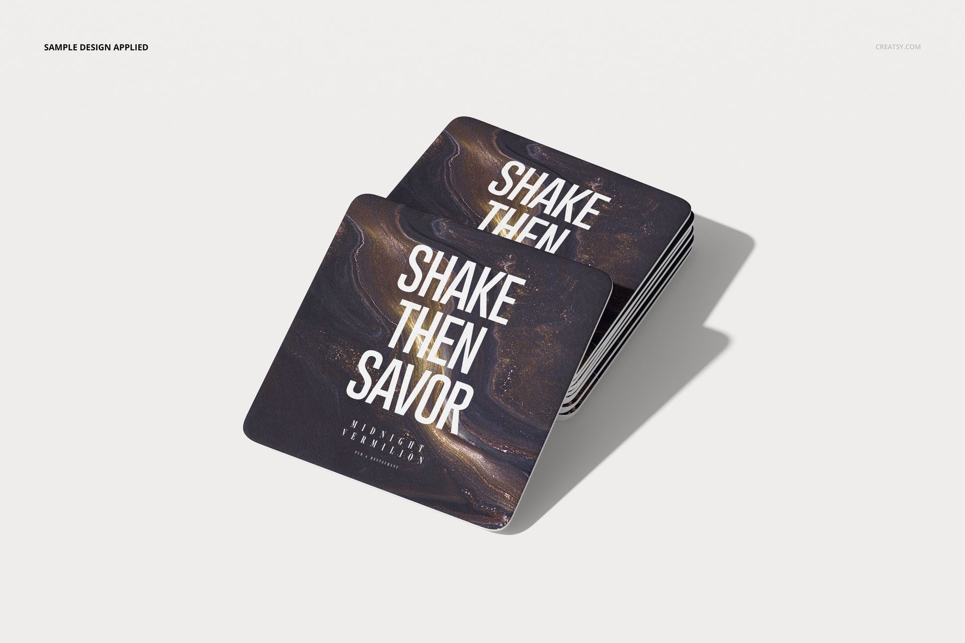 Square drink coasters mockup featuring a layered set with marbled dark pattern and large white lettering, front view.