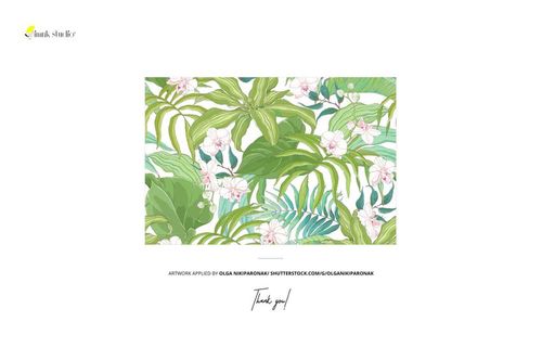 PSD mockup showing a stack of fabrics with botanical leaf and flower print placed atop cactus pads, front perspective.