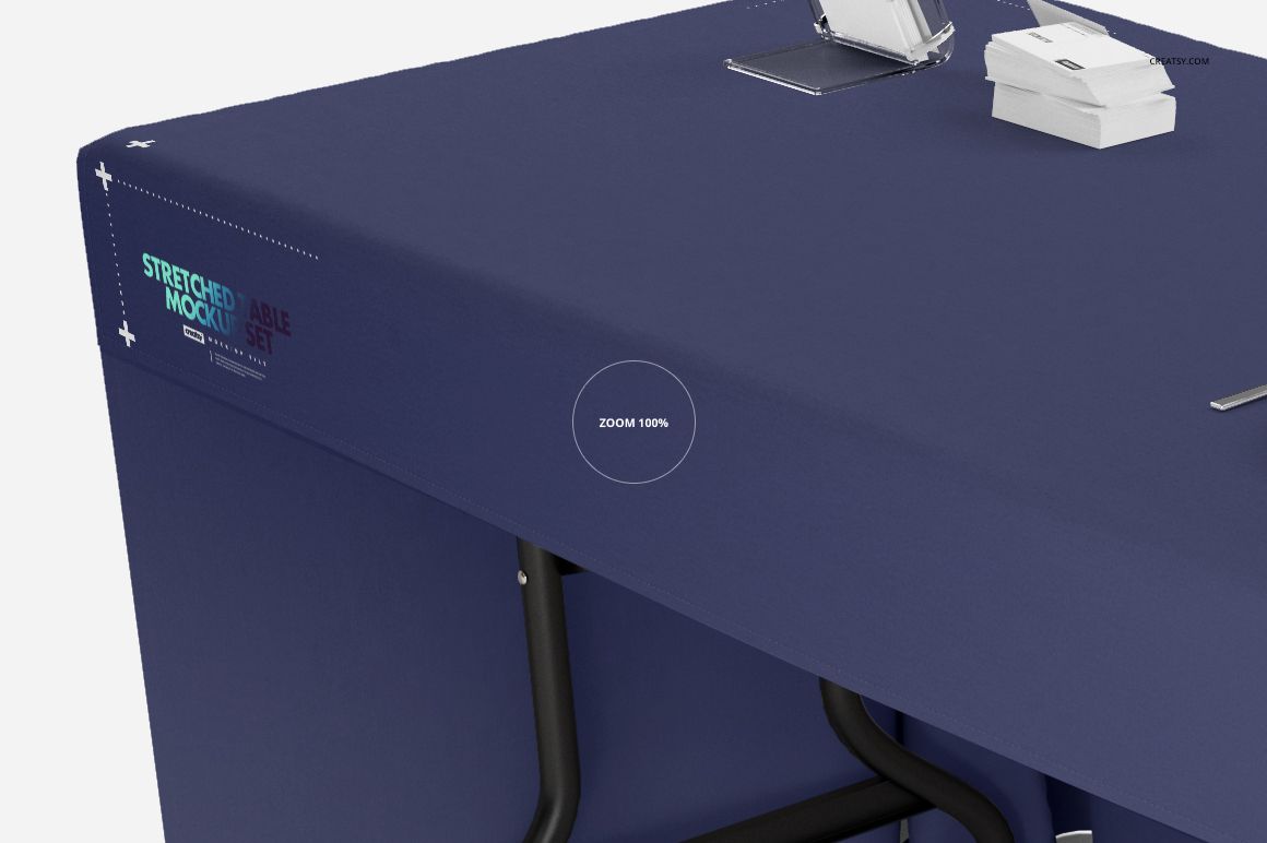 Rectangular table covered with a solid navy blue tablecloth, viewed from an angled side perspective in a mockup scene.