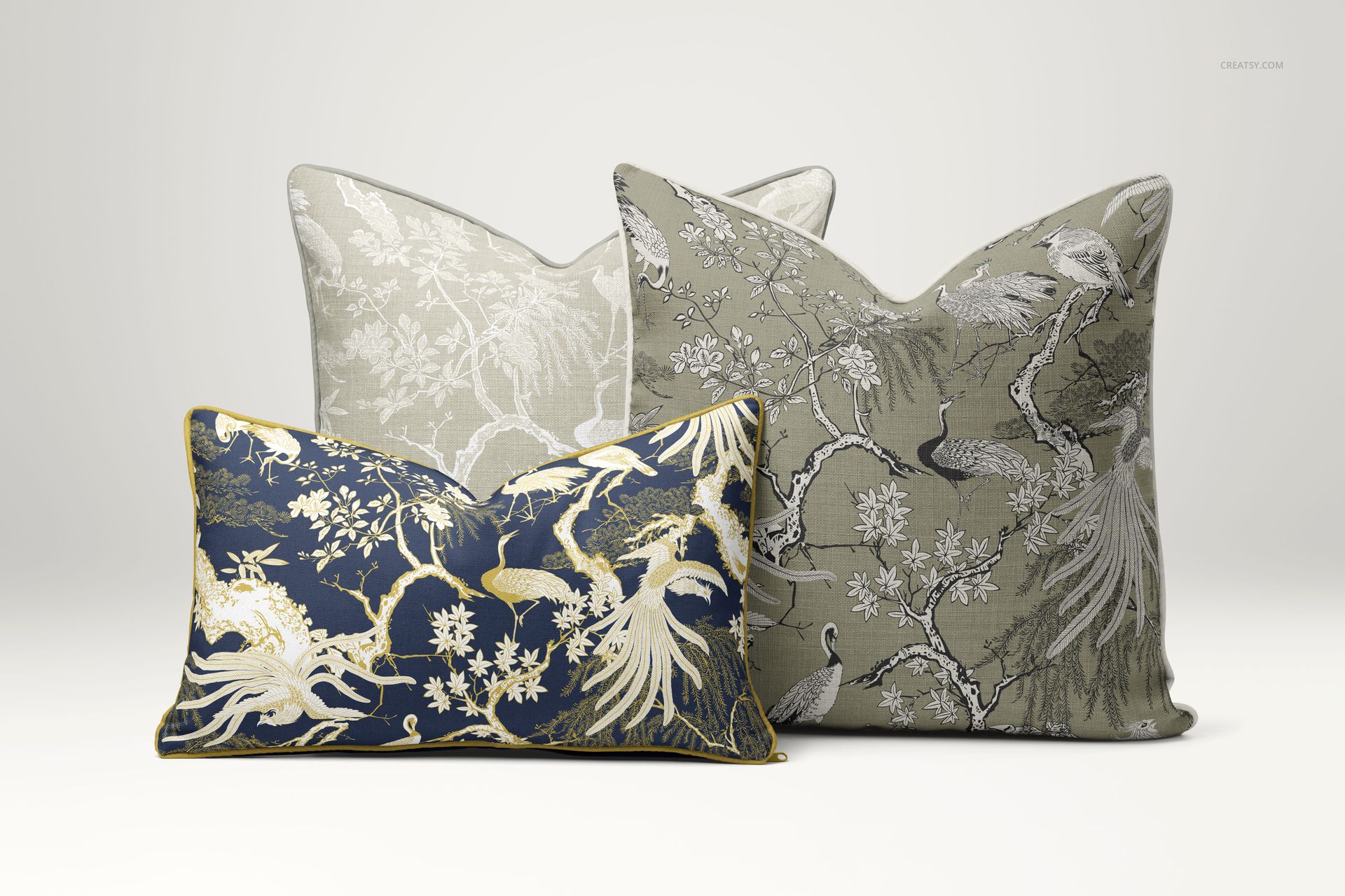 PSD mockup of reversible piped cushions in assorted sizes and colors with detailed nature-inspired designs.