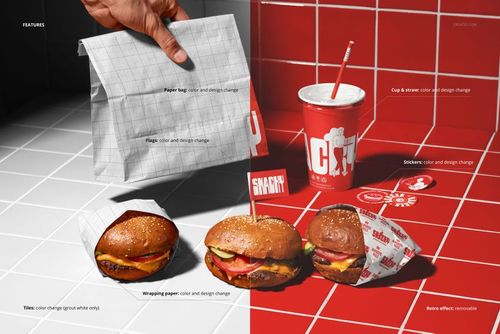Take-out burger set mockup showing three burgers in different wrappers, a paper bag, a cup with straw, and stickers on a tiled surface.