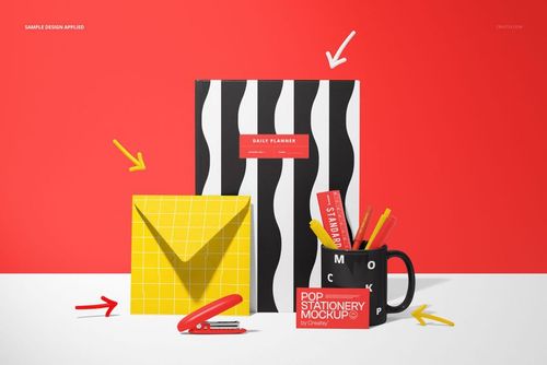 Minimal desk scene with a black and white striped notebook, yellow envelope, black mug, and business card mockup.