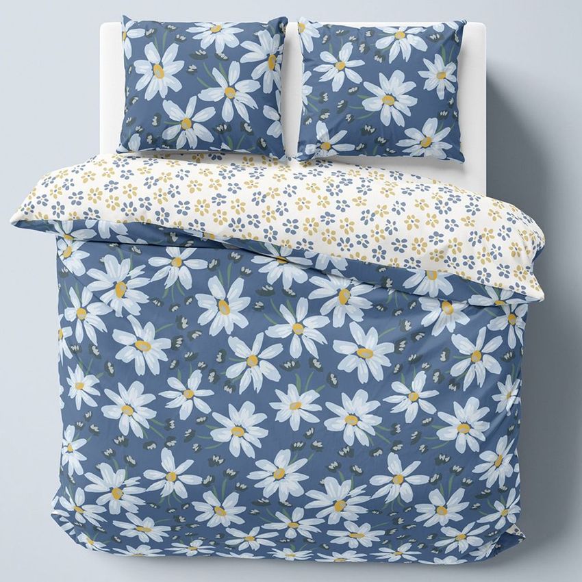 Double bed bedding mockup featuring a blue duvet and pillow covers with large white daisy patterns, shown from above.