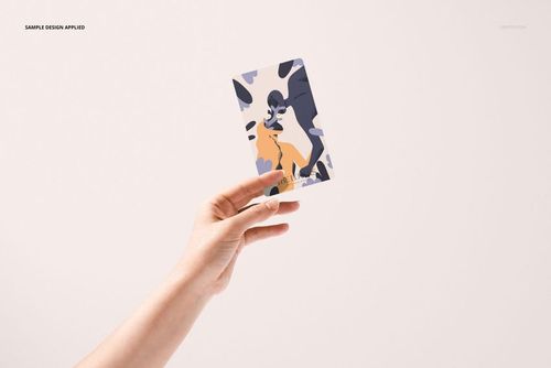 Single tarot card mockup featuring an abstract design in muted tones, held by a hand with a neutral backdrop.