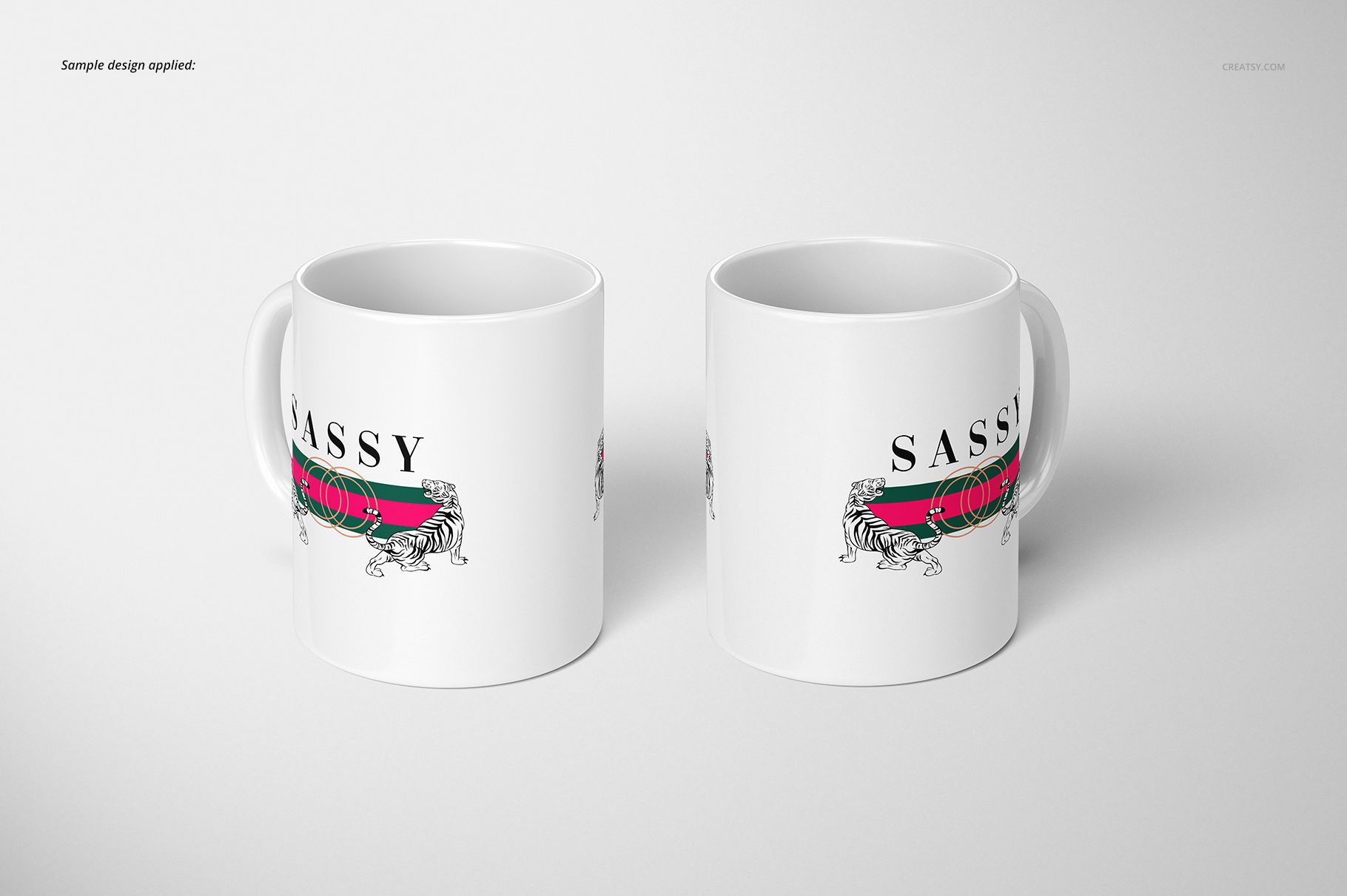 Two white 11oz mugs with a tiger illustration and bold text, shown from a front angle on a plain light background.
