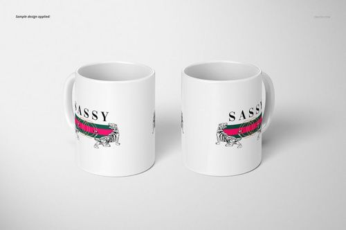 Two white 11oz mugs with a tiger illustration and bold text, shown from a front angle on a plain light background.