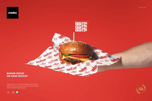 Burger mockup on a hand, featuring a wrapped burger with lettuce, tomato, and cheese against a red background.
