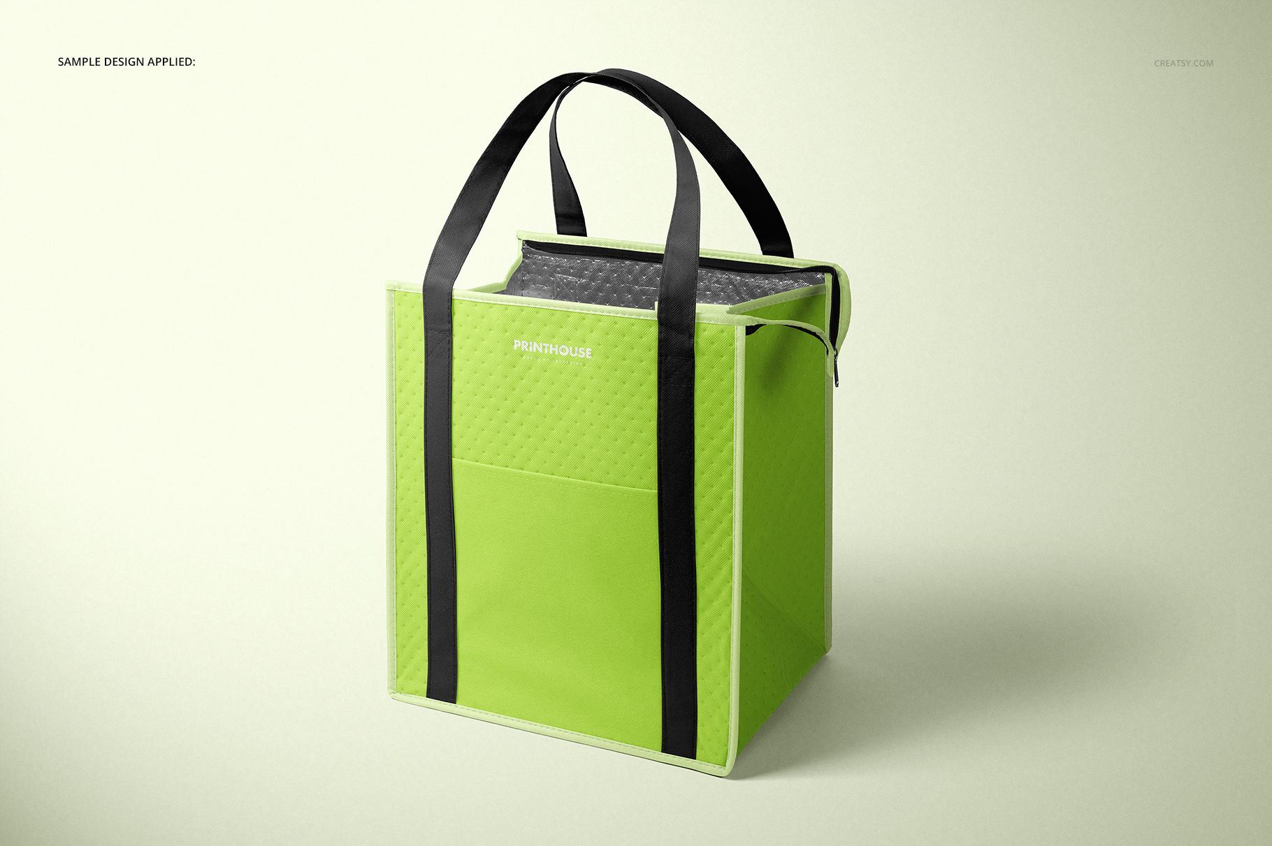 Insulated cooler bag mockup in bright green with black handles, shown in a three-quarter front view on a light background.