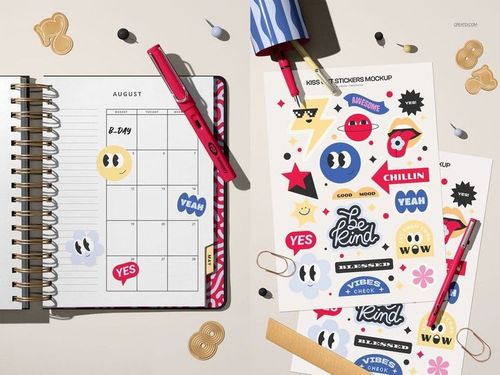 Kiss cut stickers mockup set featuring colorful stickers with playful designs on sheets beside an open planner.