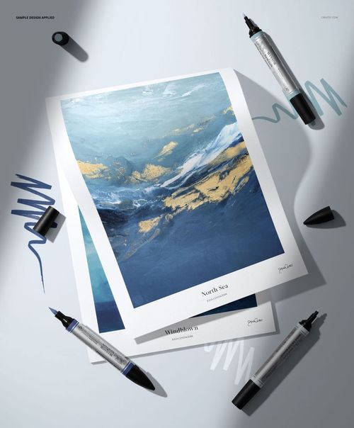 PSD mockup showing linen canvas paper pad with painted ocean scene, accompanied by uncapped markers and scribbles.