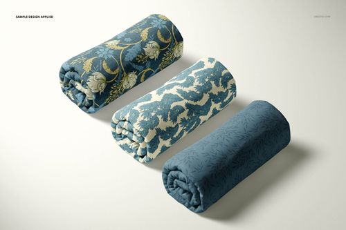 Front view of three patterned fabric rolls in blue and cream tones, shown as a PSD mockup on a neutral background.