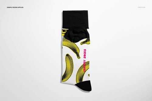 High cuff sock mockup with a white base, black cuff and heel, featuring a yellow banana pattern and pink text.