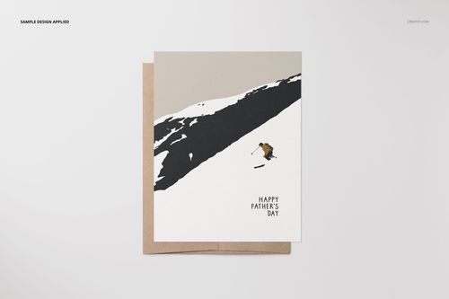 A2 card mockup featuring a skier illustration on a snow-covered slope with a brown envelope, front view.