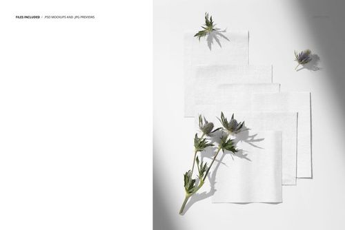 PSD mockup featuring white cotton fabric swatches and thistle flowers placed on a clean, bright background.