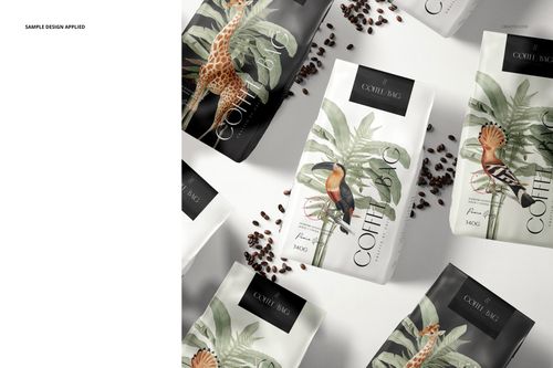 Multiple paper coffee bag mockups with tropical plant and bird designs, arranged on a light surface with coffee beans.