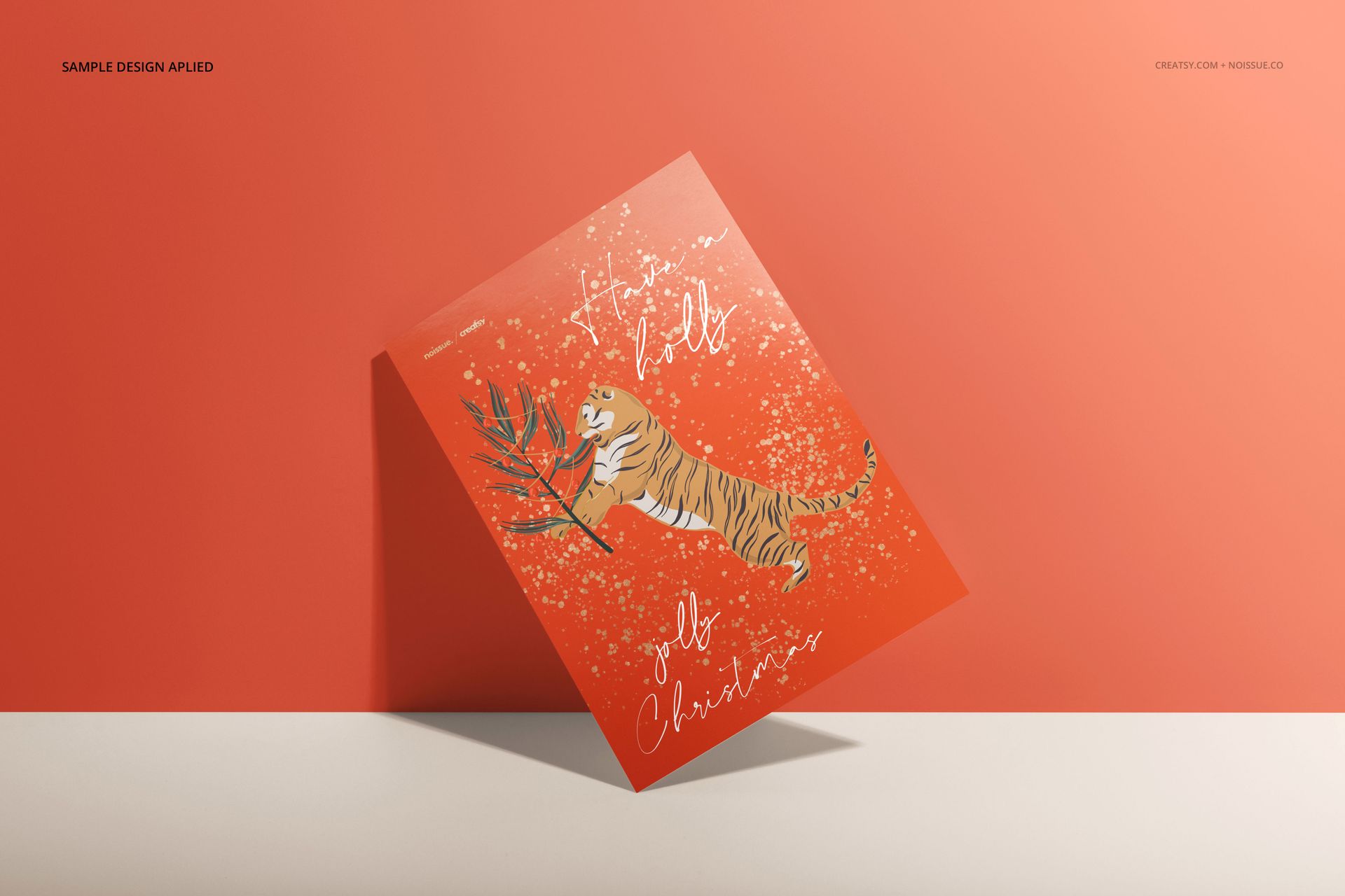 Orange card mockup featuring a leaping tiger and handwritten white text, set against a peach background with soft shadows.