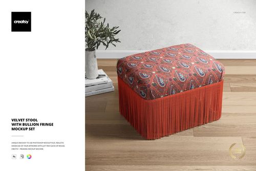 Front view of a velvet stool mockup featuring a red patterned top and bold fringe, set in a modern living room scene.