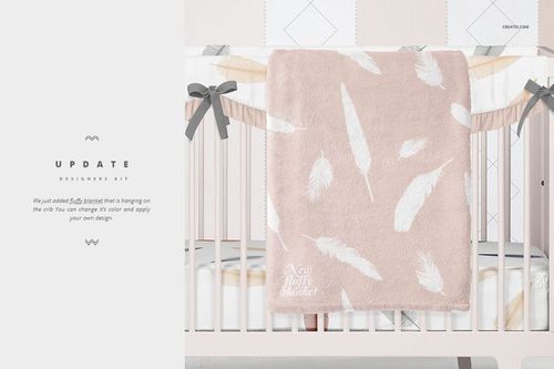Crib bedding mockup showing a pale pink blanket with white feathers, gray bows, and patterned bumper pads in a baby room.