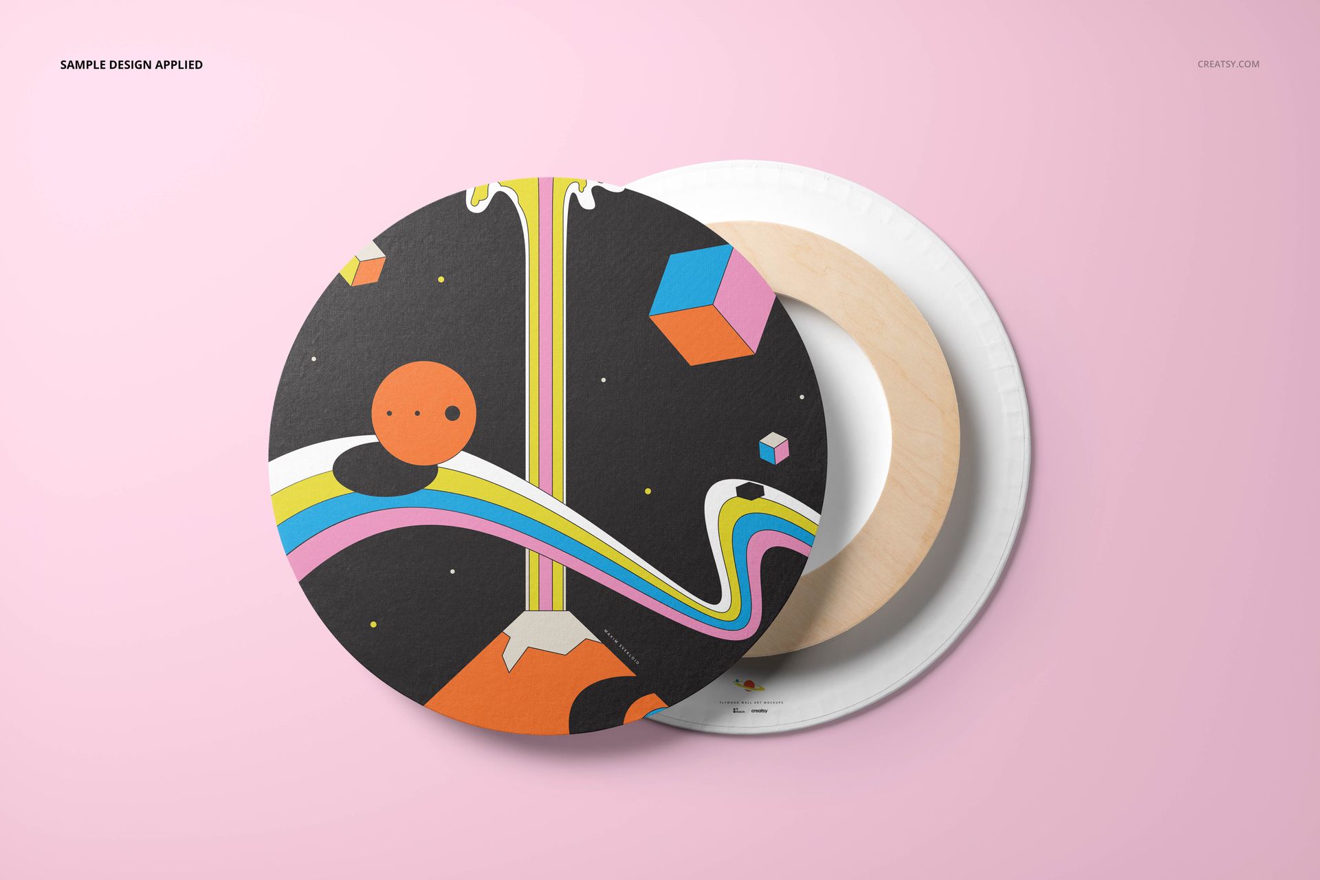 Round canvas wall art mockup with a colorful abstract design on a black background, shown on a pink surface.