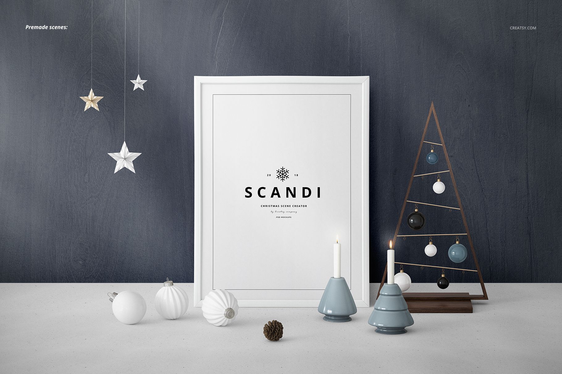 Framed poster mockup with SCANDI text, surrounded by ceramic candle holders, ornaments, and a minimalist wooden tree.