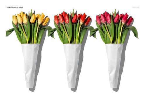 PSD mockup showing three tulip bouquets with green leaves, each wrapped in white paper, top view against a white backdrop.