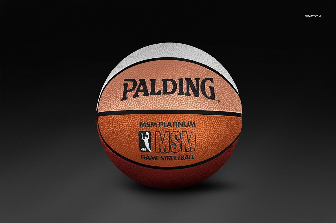 Front view of a textured basketball ball mockup featuring three colored panels on a smooth dark background.