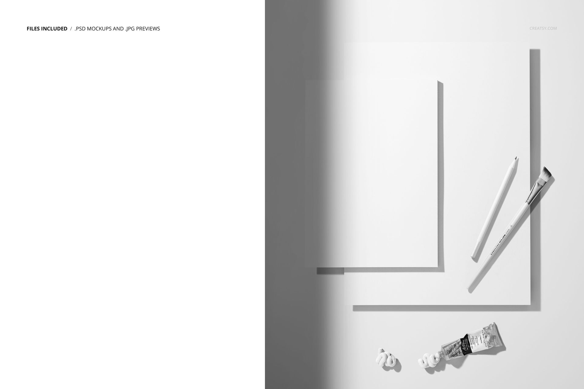 PSD mockup showing two blank paper pads, a pencil, a brush, and paint tubes on a clean, light background from above.