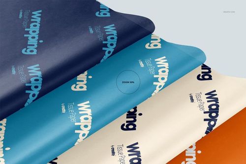 Layered wrapping tissue paper mockup with blue, white, and orange sheets, viewed from above at an angle.