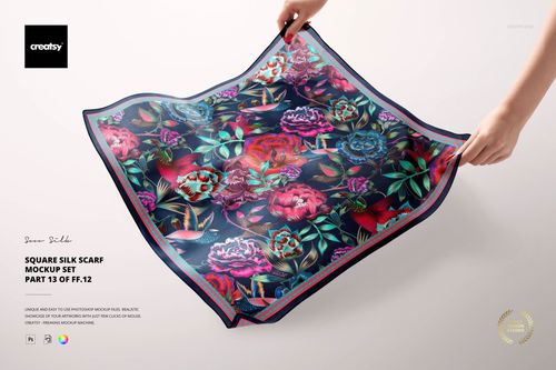 Colorful square silk scarf mockup featuring detailed flowers and leaves, shown flat with hands holding opposite corners.