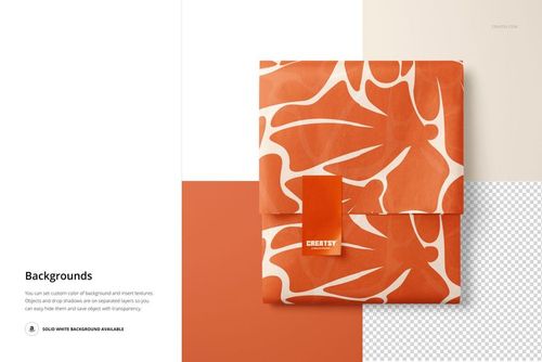 PSD mockup displaying wrapped tissue paper with an abstract orange leaf design and a rectangular sticker in the center.