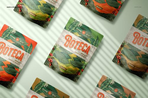 PSD mockup of doypack bag pouches with green, orange, and beige leaf motifs, shown from above with soft shadow lines.