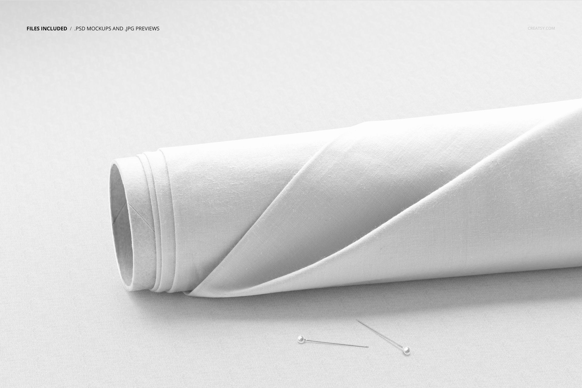 Fabric roll mockup featuring plain white textile, side view perspective, and sewing pins on a light background.
