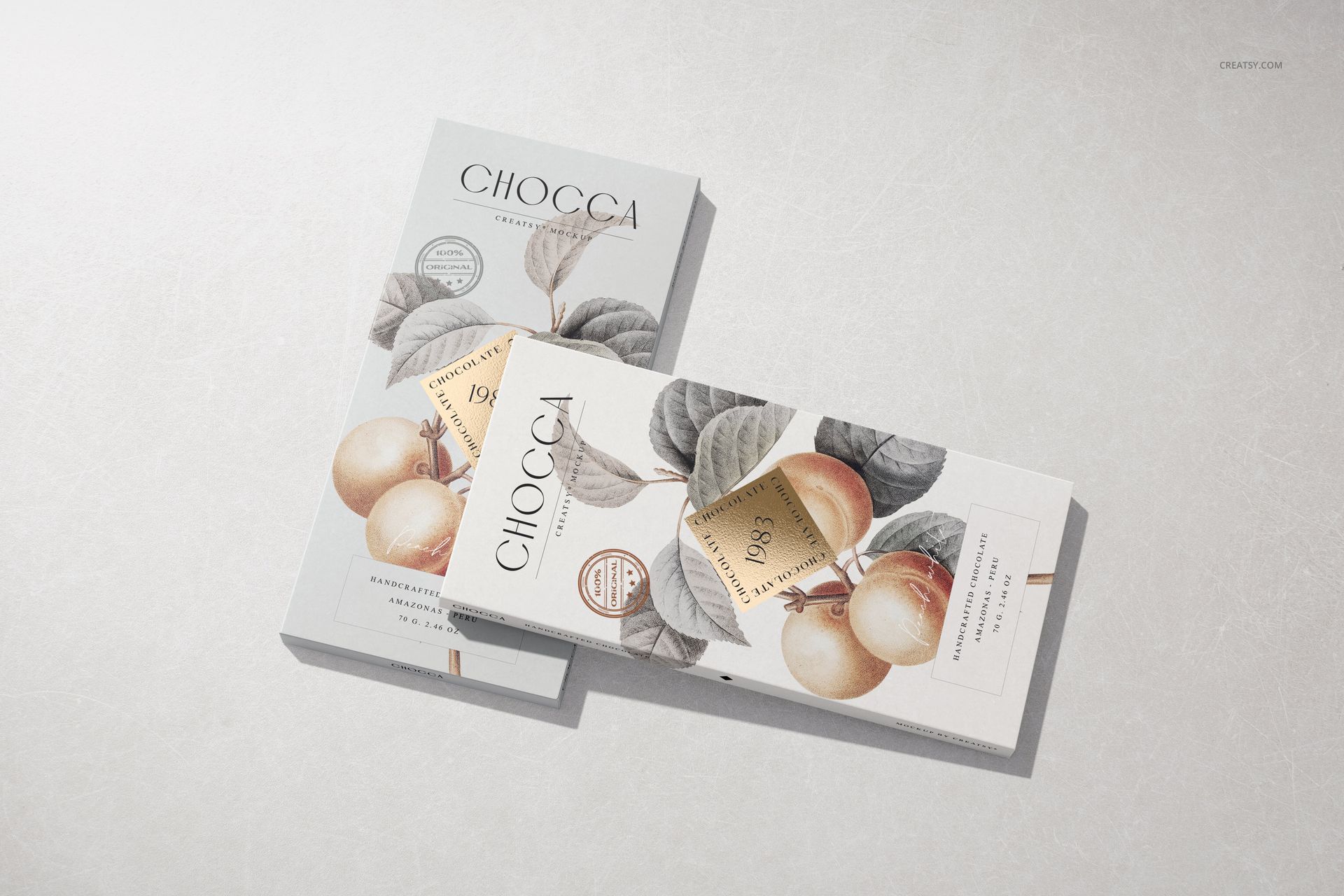 Chocolate bar packaging mockup featuring two rectangular boxes with fruit illustrations and neutral colors on a light surface.