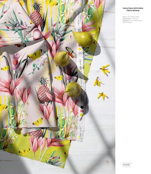 Overhead view of cotton fabric mockup with tropical floral and pineapple patterns, yellow stripes, and scattered pears.